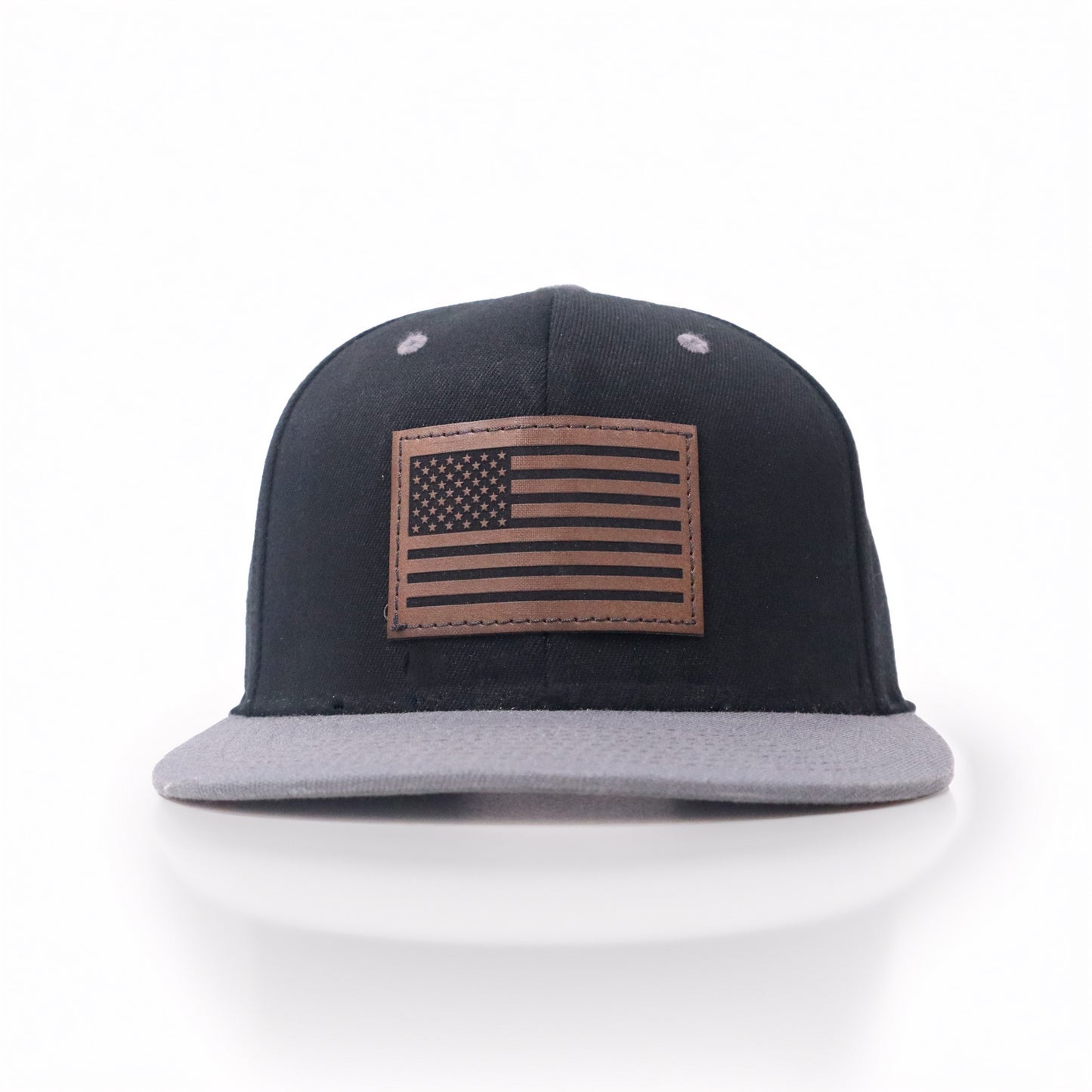 Black and gray cap with American flag patch on a white background