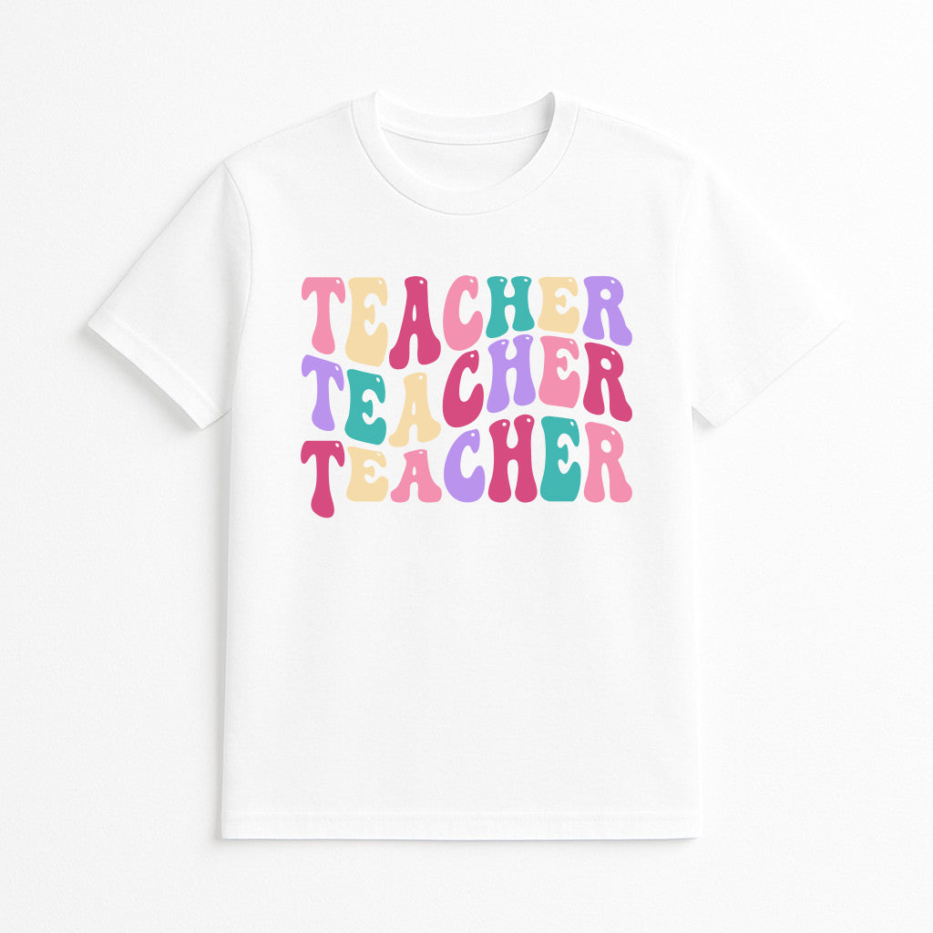White t-shirt with 'Teacher Teacher Teacher' text in colorful letters on a white background