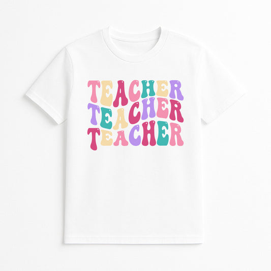 White t-shirt with 'Teacher Teacher Teacher' text in colorful letters on a white background