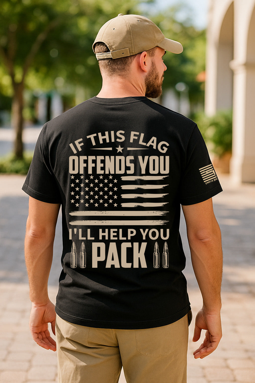 Man wearing black patriotic t-shirt with bold If This Flag Offends You I'll Help You Pack slogan, distressed American flag graphic and sleeve flag print, conservative pro-America shirt