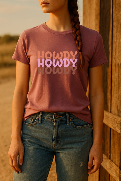 Person wearing a 'HOWDY HOWDY HOWDY' t-shirt in a desert setting