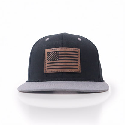 Black and gray cap with American flag patch on a white background