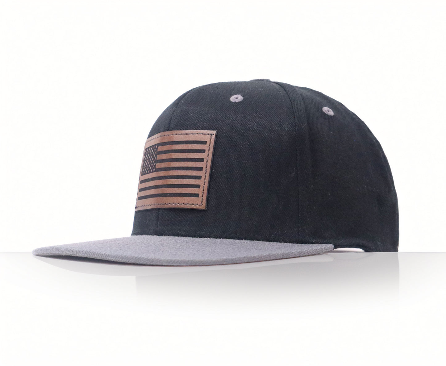 Black cap with American flag patch on a white background