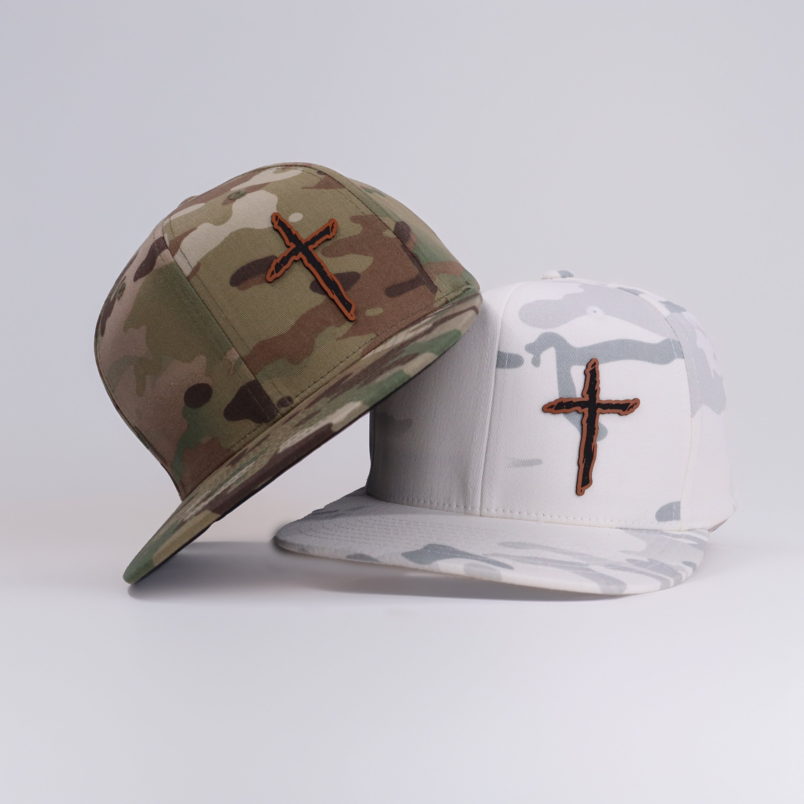 Snapback hat — Cross leather patch in woodland and snow camo — Lonestar Heritage Outpost