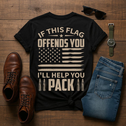 Black t-shirt with text and American flag design on a wooden surface with shoes, jeans, and accessories.