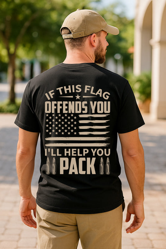 Man wearing a black t-shirt with a message and American flag design outdoors.