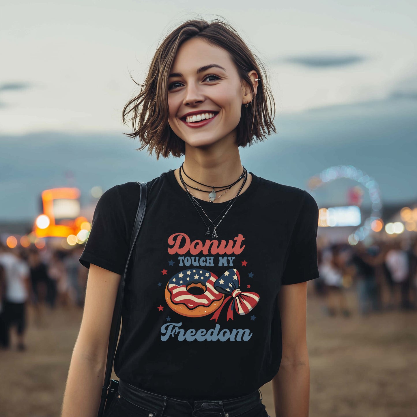 Model wearing black Donut Touch My Freedom patriotic t-shirt with American flag donut graphic