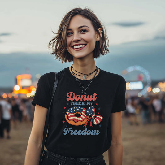 Model wearing black Donut Touch My Freedom patriotic t-shirt with American flag donut graphic