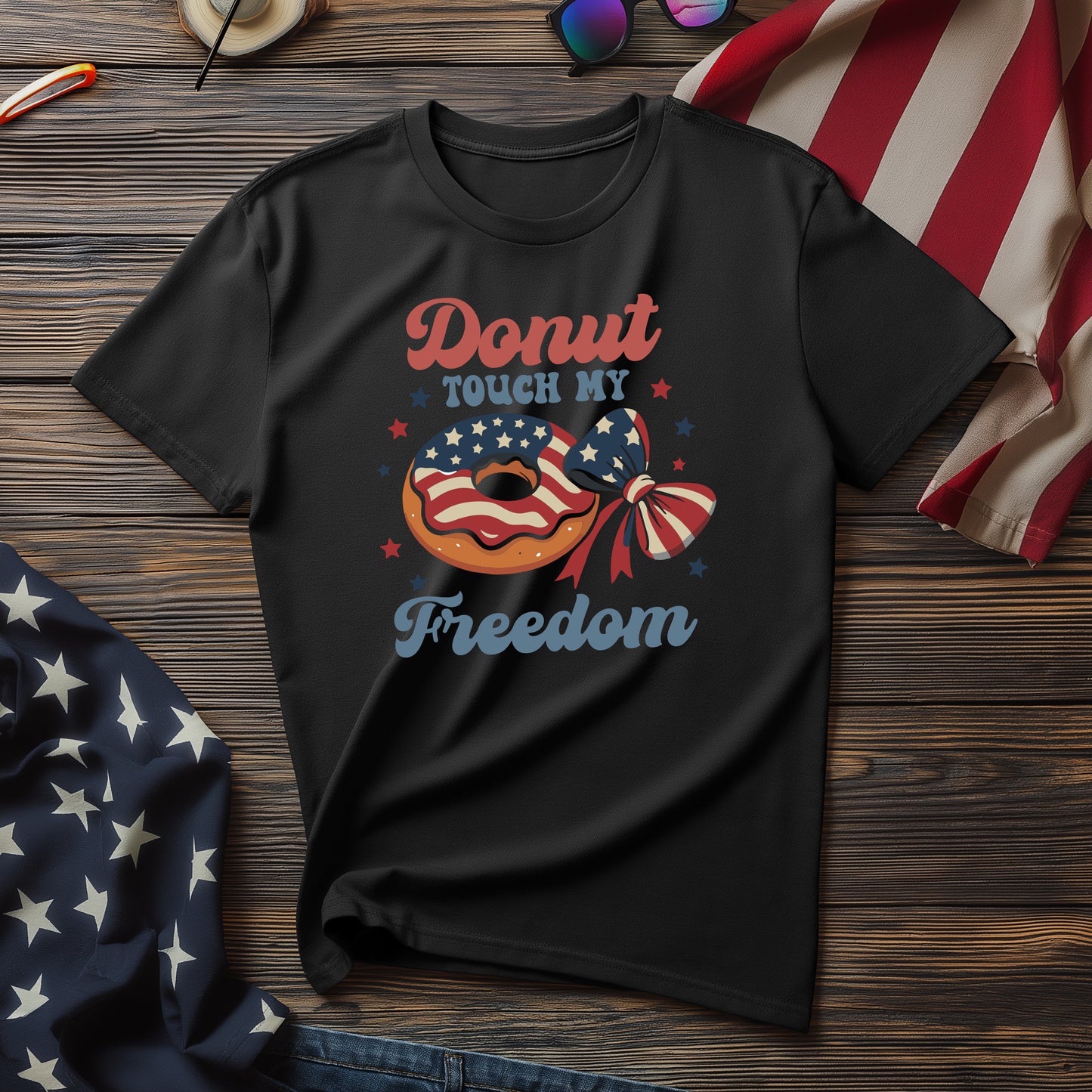 Black Donut Touch My Freedom graphic t-shirt with patriotic donut and bow design