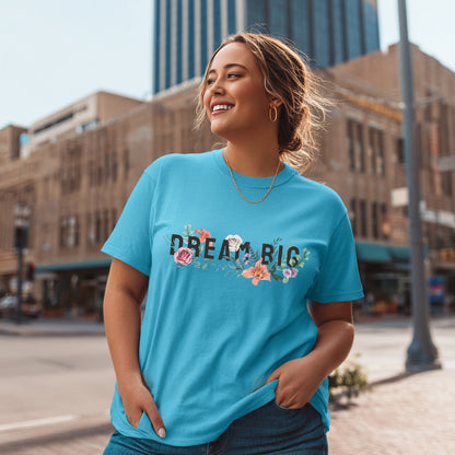 Teacher wearing Dream Big Blue t-shirt with floral graphic design, inspirational classroom shirt with positive message for educators