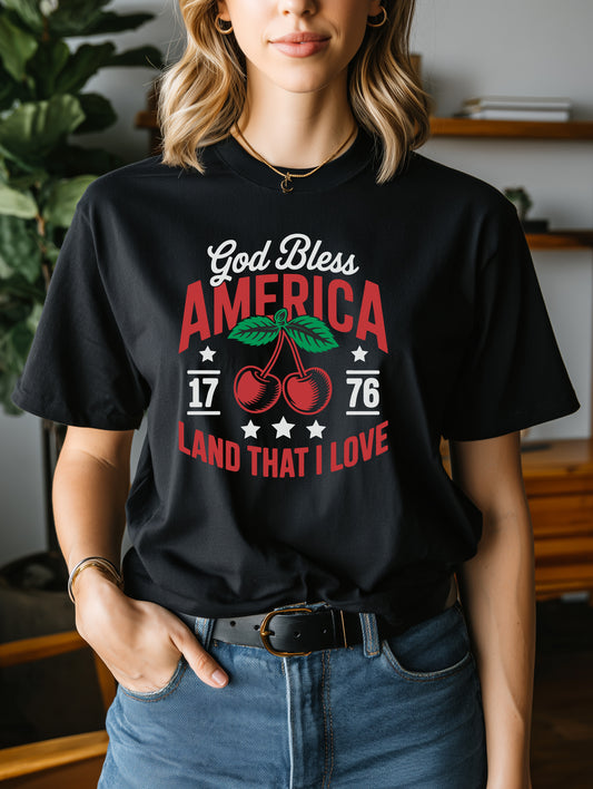 Model wearing black God Bless America cherry t-shirt with 1776 graphic, patriotic womens Americana tee
