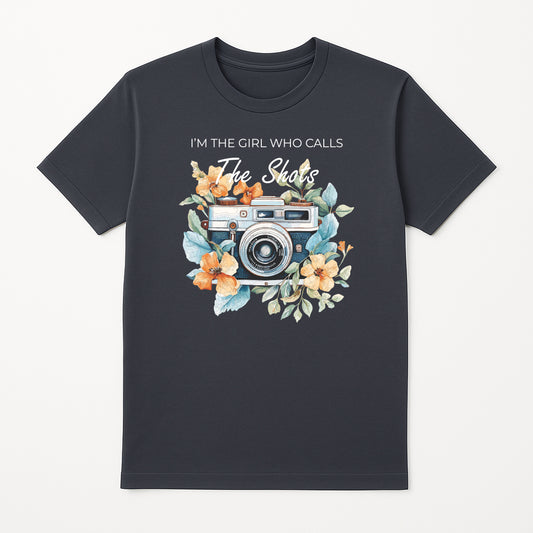 Grey photographer graphic t-shirt with vintage camera floral design and I’m the Girl Who Calls the Shots text