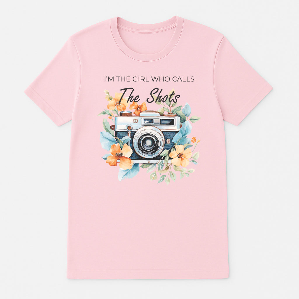 Pinkphotographer graphic t-shirt with vintage camera floral design and I’m the Girl Who Calls the Shots text