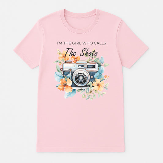 Pinkphotographer graphic t-shirt with vintage camera floral design and I’m the Girl Who Calls the Shots text