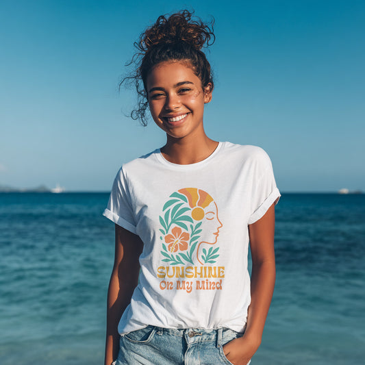 Model wearing white Sunshine On My Mind graphic t-shirt with retro tropical coastal design