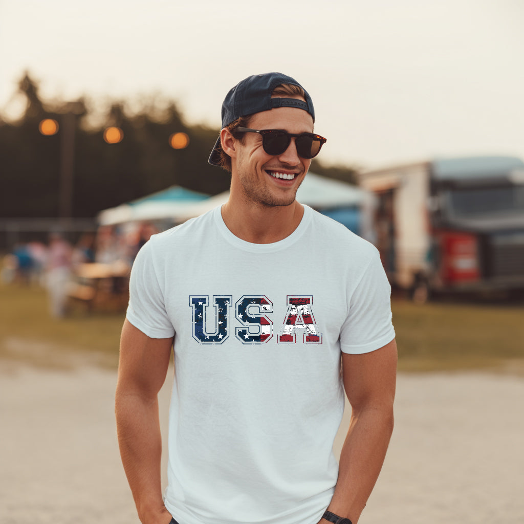 Men’s white patriotic t-shirt with bold USA distressed American flag design, grunge style USA graphic tee for Fourth of July, barbecues, and patriotic celebrations